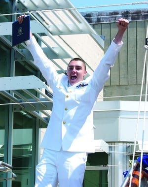 Joseph Jenkins of Quincy celebrates graduating from the Massachusetts Maritime Academy in Buzzards Bay.