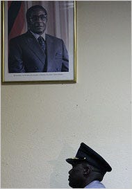 The police commissioner of Zimbabwe, Augustine Chihuri, on Monday, beneath a picture of President Robert Mugabe.