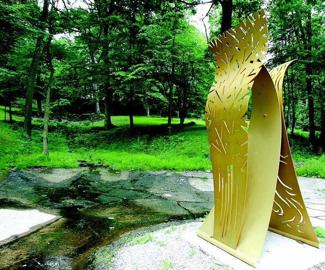 A sculpture by Charlotte Lees titled “Landscape” stands at the Aaron Seesan Memorial.