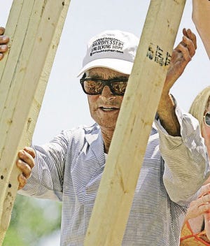 Bill Haber/The Associated Press
World-famous hairdresser Vidal Sassoon helps raise framing for a wall at a Habitat for Humanity home in Slidell, La., Monday. Sassoon is working with Habitat and Hairdressers Unlocking Hope on the Hurricane Katrina recovery project.