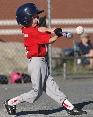Lugnuts batter Carter Nevalis, 6, gets a hold of one to help his team.