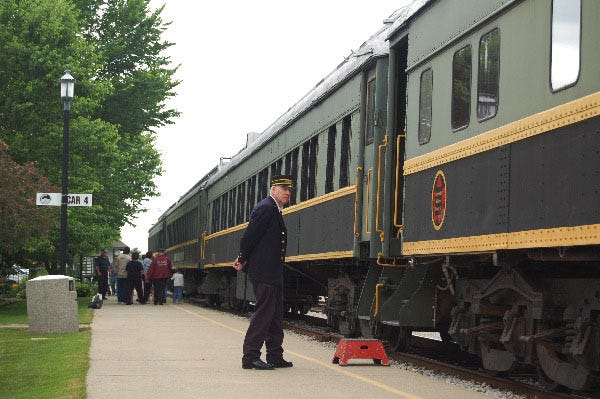 D.J. Sobish/Grand Haven Tribune
Conductor Bruce Quinn waits to board passengers onto the History Express in Coopersville.