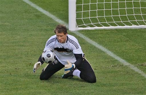 Germany's goalkeeper Jens Lehmann makes a save during practice on Saturday.