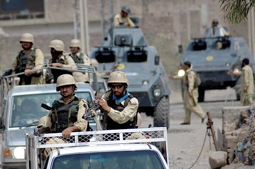 Soldiers of Pakistan's paramilitary force enter into a troubled area after a crackdown operation at Bara Akakheil in Pakistan's tribal area of Khyber on Sunday.