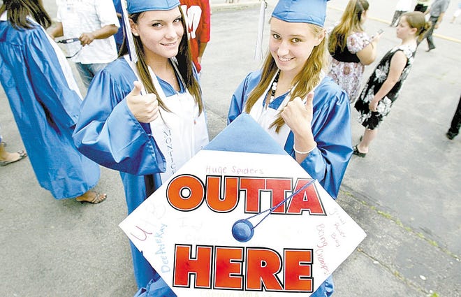 There are 177 students graduating this year from Monticello High School. Above, Samantha Schoonmaker’s cap gets approval from classmates Nicole Desanno, left, and Chelsa Reuss before the start of Sunday ceremony.