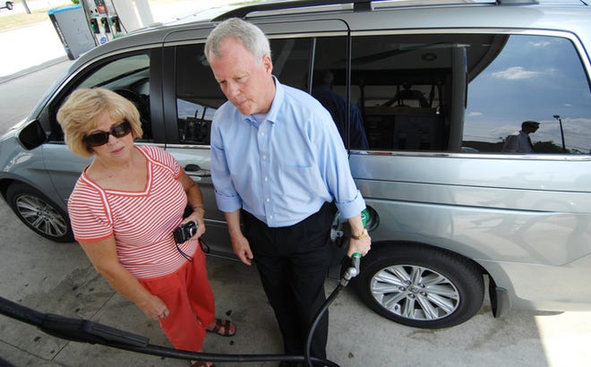 Congressman Paul Broun pumps gas for Dell Phillips at a BP station on Wheeler Road in an effort to draw attention to his proposals to move the U.S. toward energy independence.