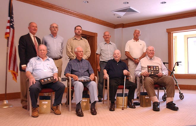 Eight Holland Veteran were awarded medals they received for there service in the military that they did not receive after their discharge from the military by U.S. Rep. Pete Hoekstra, R-Holland, back row left. They are front row, from right, William Vogelzang, Donald Bouman, Louis VanSlooten, Dale Moes, Back row, from right, Robert Prins, Kenneth Frieling, Kurt Hines, and Richard Vredeveld.