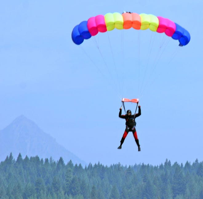 Tom Morris guides his canopy of a wing in for a safe landing as part of his practice in preparation for his twenty-second straight 4th of July jump at the Mount Shasta Run Walk event.
