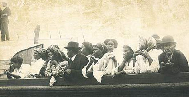 This file photo from 1914, shows immigrants from Brava, Cape Verde, looking ashore from the Savoia as the await the disembarkation process to be finished.