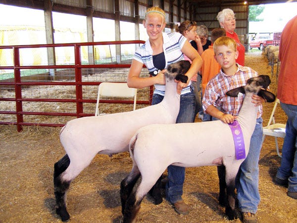 Andrew and Sarah Deschepper of Altona showed the champion pair of market lambs in the Market Lamb Show Tuesday night, June 24, at the Henry County Fair.