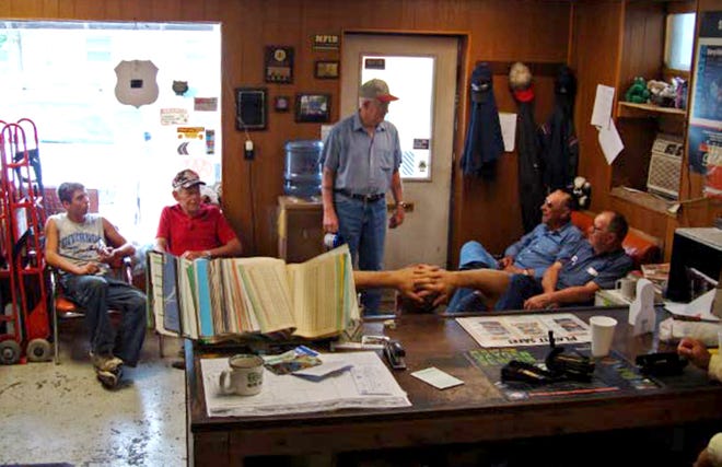 Harry Reavis, center, arrives for morning coffee at Herman Goddard’s auto repair shop in Divernon. He joins other regulars, from left, John Caudle Jr., Eddie Burge, Bill Hundley and Goddard.