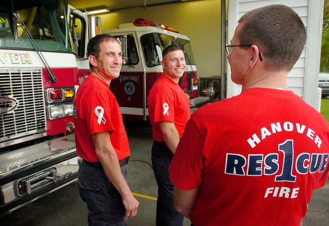 From left, Hanover firefighters Martin Alfis, Chris Azizian and Capt. Rob Kenney wear their Friday red shirts to honor troops overseas. Fire departments around the country are adopting the gesture.