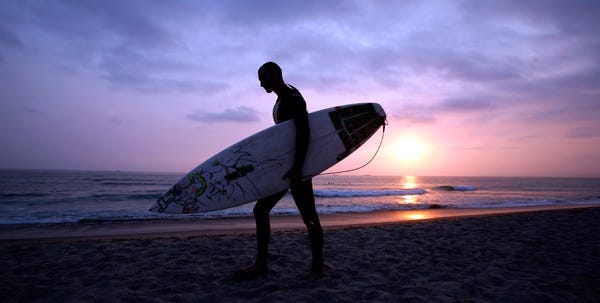 Surfer Alan Harrison checks the surf at Tresles in San Clemente, Calif., recently. The surging cost of oil has been a dose of reality for many surfers who have long thought of their sport, with all its sun-kissed lore, as a counterculture niche shielded from the pressures of mainstream America.