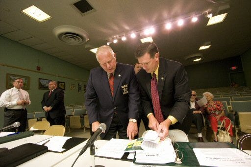Sheriff Ed Dean, left, and Bureau Chief Jerry P. Holland Jr. prepare to present the Sheriff's Office budget proposal to the County Commission on Wednesday.