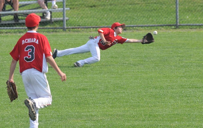 Saugus National Little League all-star right-fielder Anthony Allan saves two runs with a spectacular diving catch early in a District 16 Williamsport Tournament game against the Saugus Americans at Wyoma in Lynn July 6. The Nationals came back to win this game, 9-4.