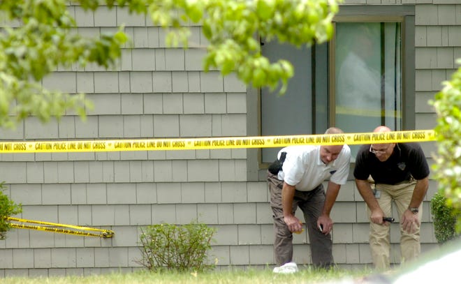 Investigators look for evidence outside the Ramblewood apartment where a man was found dead. Police investigate the death of a 25-year-old Holbrook man who was found dead in his apartment, apparently killed sometime Thursday evening, Authorities said today. Norfolk County District Attorney Wiliam Keating, left, and Holbrook Police Chief Jonathan R. Cordaro gave details to the media.