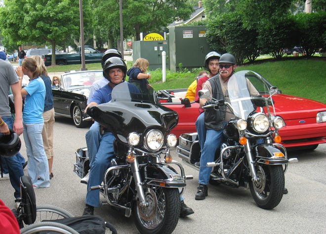 Harley Davidson motorcycles and a variety of convertible cars line up Saturday at City on a Hill Ministries. The event, which gave disabled children a chance to ride cool vehicles, was part of Special Needs SERVE Week.