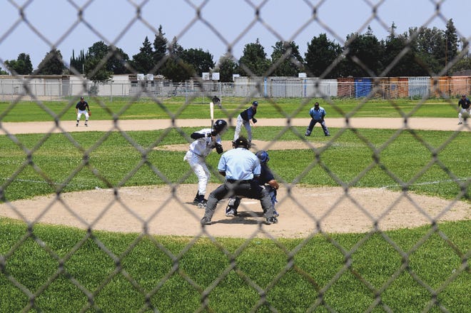 The Stockton Indians play against the Tracy Yankees in a Valley Baseball League on Sunday in Manteca. The Valley Baseball League a 28-and-older league formed in 1993 banned aluminium bats in 2003.