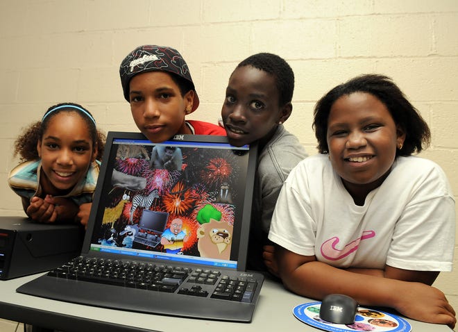 From left, Jenny Perez, 13, Xavier Perez, 15, Chibulzor Ogbue, 12, and Karen Namubiro, 10, from the MetroWest Boys & Girls Club took part in a digital mural project held by Intel to mark the company's 40th anniversary.