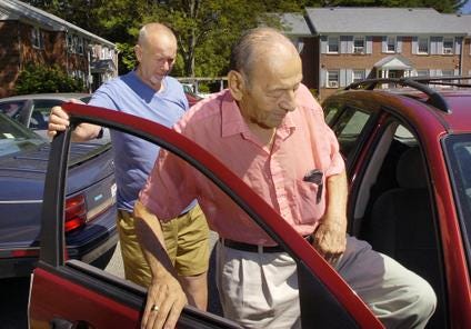 Sherman Poole, left, has been driving local people to medical appointments for 17 years. The 78-year-old Pembroke resident, shown giving a ride to Pasquale Picariello of Pembroke, recently received the President’s Volunteer Service Award.