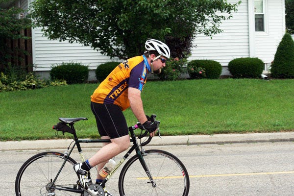 Scott Schnaufer takes off down Chicago Street July 12 during the Geneseo Bike Club’s Saturday ride.