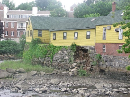 A portion of the foundation, or river wall, supporting the office building at 4 String Bridge was swept away during last weekend’s storm. Exeter Building Inspector Bob Eastman said he is unaware of a plan for repair but stated the state Department of Environmental Services may need to be called in.