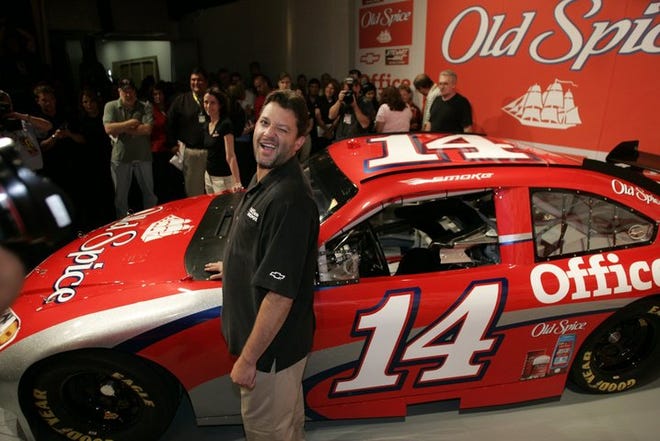 Tony Stewart unveiled the car he'll drive next year when he moves to Stewart-Haas Racing. The No. 14 honors legendary racer A.J. Foyt.