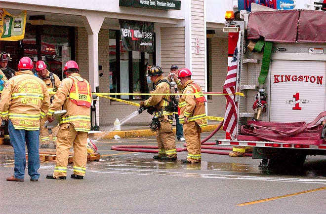 Emergency workers at the scene of Sunday's chemical spill at Aubuchon Hardware in the Kingston Plaza on Route 53.