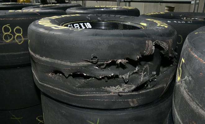 Deficient tires supplied by Goodyear forced NASCAR to slow down Sunday's race at the Brickyard. Drivers had to pit regularly, and a record 52 of 160 laps were run under caution.
