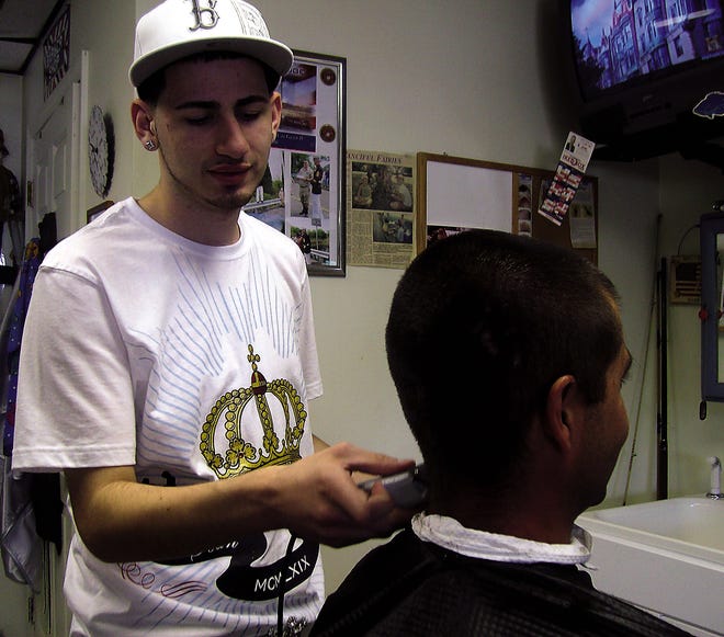 Sean Martin is the newest employee at Woody's Barber Shop in Dighton.