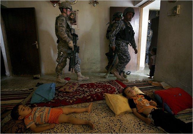 American soldiers searched houses in Khan Bani Saad in Iraq. A security agreement being negotiated sets terms for the presence of American troops, but it does not specify a withdrawal date.