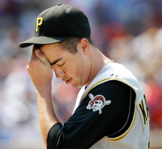 Pittsburgh Pirates starting pitcher Jeff Karstens wipes his face after the fifth inning Friday, Aug. 1, 2008.