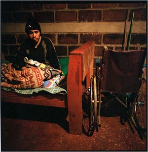 Luis Alberto Jiménez, an illegal immigrant injured in a car accident in Florida, was treated at a community hospital, which eventually sent him back to Guatemala. He spends most of his days inside a one-room house; only the presence of visitors, who can help him into his wheelchair, gives him the rare chance to get out of bed.