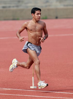 U.S. men's 1,500-meter runner Leonel Manzano runs during his morning practice for the upcoming Beijing Olympic Games at a university in Dalian, Liaoning province, China, Monday, Aug. 4, 2008. Manzano is one of only two fully Hispanic members of the U.S. Olympic team.