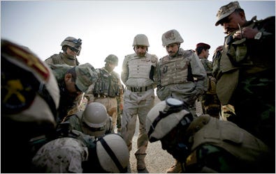 “Believe me,” said Col. Ali Mahmoud, center, checking a map with his troops in Diyala Province. “There will be a big disaster” when American forces leave.