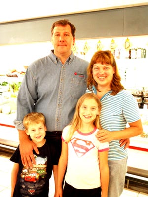 The new owners of Henicles Markets, one in Waynesboro, one in Fayetteville and the wholesale warehouse, are David and Heather Peiffer of Waynesboro and their children, Simon, 5, and Maggie, 8.