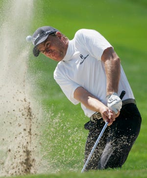 Robert Karlsson, of Sweden, hits from a bunker on the 13th hole during the first round of the 90th PGA Championship golf tournament Thursday, Aug. 7, 2008 at Oakland Hills Country Club in Bloomfield Township.