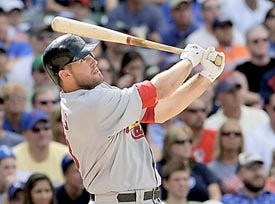 St. Louis Cardinals' Troy Glaus hits a three run home run during the fifth inning of a baseball game against the Chicago Cubs on Saturday, Aug. 9, 2008, in Chicago. (AP Photo/M. Spencer Green)