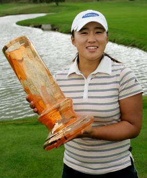 South Korea's Amy Yang holds her trophy after winning the Scandinavian TPC 
golf tournament at the Frosaker Golf Club in Vasteras, Sweden, Sunday.