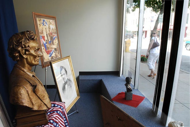 A window display presented by Abraham Lincoln re-enactor George Buss is on display at 1 E. Stephenson Street Monday afternoon. Memorabilia and historical items line the windows of many downtown buildings.