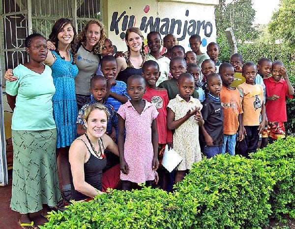 Madeleine du Pont, fourth from the left in the back row, and Alexis du Pont, first in the bottom row, with children of the Kilimanjaro Kids Care Orphanage.