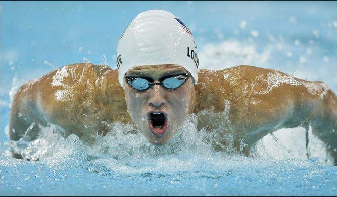 United States' Ryan Lochte swims in a men's 200-meter individual medley heat during the swimming competitions in the National Aquatics Center in Beijing on Wednesday.