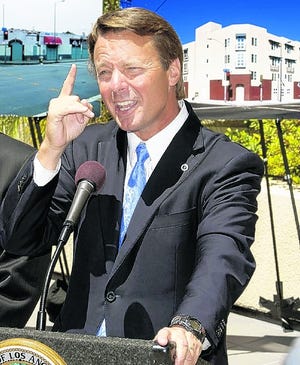 ** FILE ** In this July 21, 2008 file photo, former North Carolina Sen. John Edwards gestures during a news conference Los Angeles. Edwards is admitting to an extramarital affair but denies fathering the woman's daughter. (AP Photo/Damian Dovarganes, File)