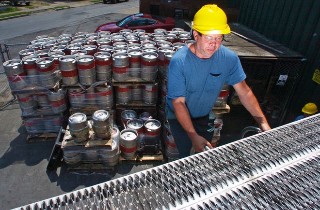 Brewer Brian Owens of Barneveld waits atop a tanker truck, Wednesday, June 25, 2008, as it is filled with beer outside the F.X. Matt brewery in Utica. The company is sending its product to a bottler in Rochester until its own bottling facility is repaired following a fire on May 29.
