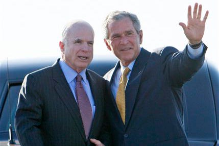 President Bush is accompanied by Republican presidential candidate, Sen. John McCain, R-Ariz., before Bush boards Air Force One at Phoenix Sky Harbor International Airport, after Bush attended a private campaign fundraising event for McCain in Phoenix, Ariz., in this Tuesday, May 27, 2008 file photo. Bush's popularity has tanked, but boy can he still bring in the cash. He's raked in close to a billion dollars during his White House tenure.