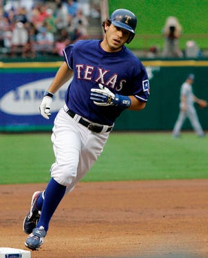 Texas' Ian Kinsler rounds third after hitting a solo homer in the first inning Saturday.