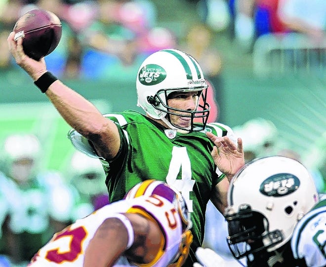 JETS QUARTERBACK BRETT FAVRE THROWS A PASS IN HIS first game action since he was traded from the Green Bay Packers to the Jets. Favre threw a 4-yard touchdown pass in the first quarter in the Jets' preseason game against the Washington Red skins.