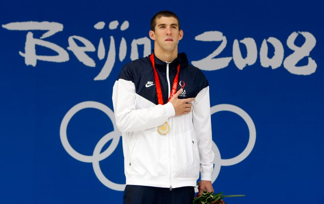 United States Michael Phelps celebrates his gold medal in the men's 200m individual medley final during the swimming competitions in the National Aquatics Center at the Beijing Olympics  on Friday.