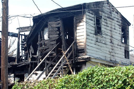 The entire second story of this Memphis, Tenn. house was destroyed by fire, killing seven, Saturday, Aug. 16, 2008. Five children, a teenager and an adult were killed, according to officials.