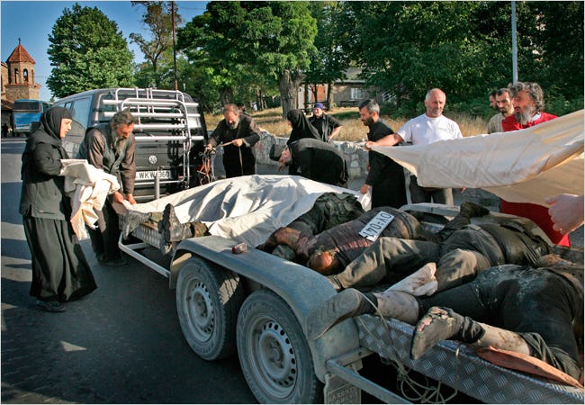 Priests and nuns covered the bodies of Georgian soldiers in Gori, Georgia. An official estimated that 115 Georgian soldiers had died since the conflict began.